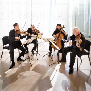 Juilliard Quartet, seating and playing their instruments