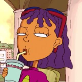 A purple-haired, brown cartoon girl with red sunglasses on her head sips a beverage from a straw and gives a sidelong glance