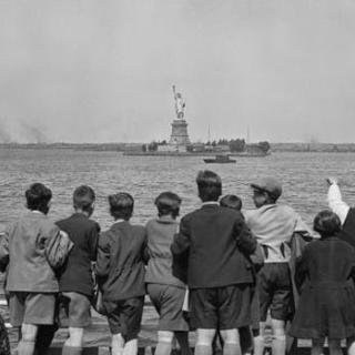 Young immigrants arriving on a boat see the Statue of Liberty for the first time from across the water. Source: Ellis Island Foundation, Inc./National Park Service