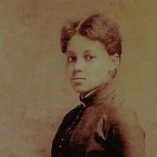 historical photographic portrait of a young Black woman wearing a formal dress