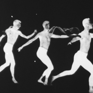 Three white silhouettes of a human figure against a black background, suggesting one person in graceful motion