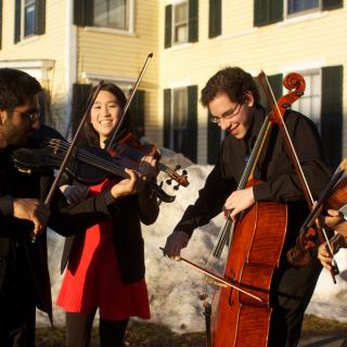Half Mendelssohn Octet, performing outdoors on campus