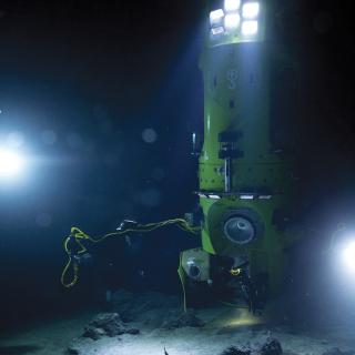 Photo of a research vessel on the ocean floor