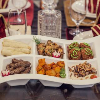 image of small portions of Arabic food on a well-set dining table