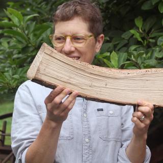 Gina Siepel holding a piece of wood