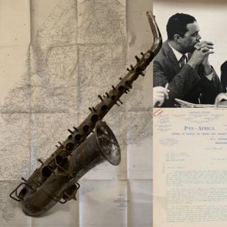 Background map with photo of saxaphone and Randolph Bromery