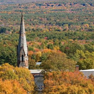 Stearns Steeple in front of the Mead Art Museum. Trees are full of rich fall colors. 