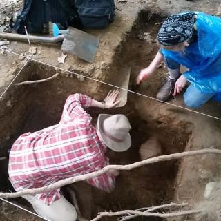 Two people digging in the ground at the Archaeology Field School