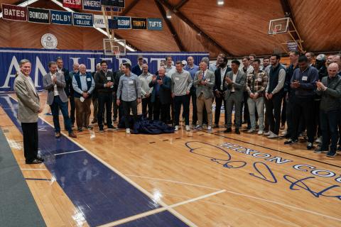 Dave Hixon '75 and friends admire the newly dedicated basketball court