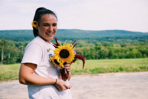 Me holding flowers during first-year orientation here at Amherst