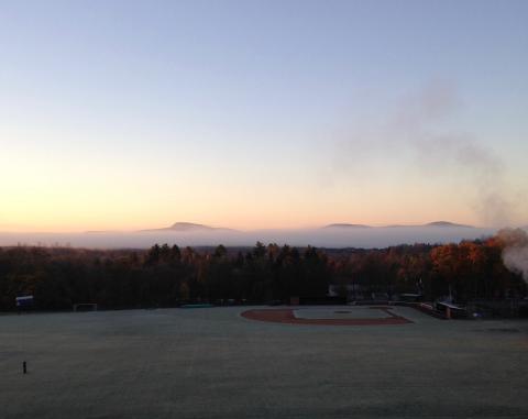 Mountains and a baseball field on a cold morning