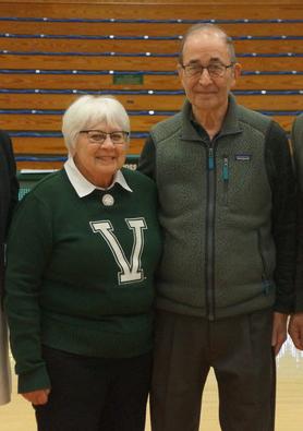 Betty and Paul Mayer, Class of 1965, together in a gymnasium.