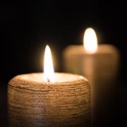 An image of two lit candles