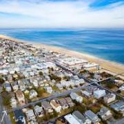 aerial view of neighborhoods along beach and ocean