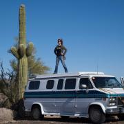 Jessica Bruder standing on top of her van
