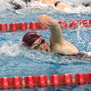 A swimmer in a pool racing